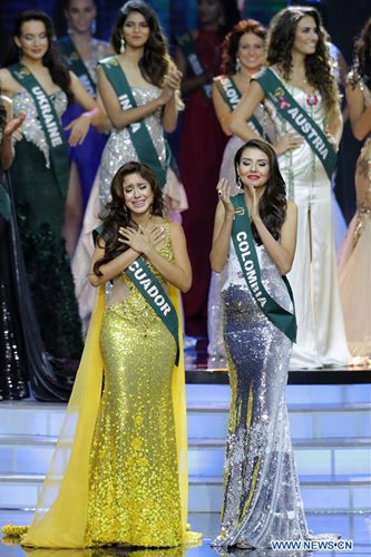 Miss Ecuador Katherine Espin(L), newly crowned Miss Earth 2016, reacts during the coronation night in Pasay City, the Philippines, Oct. 29, 2016. A total of 84 contestants vied for the Miss Earth 2016 crown to promote environmental awareness.  Photo:Xinhua