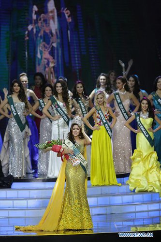 Miss Ecuador Katherine Espin (front), newly crowned Miss Earth 2016, reacts during the coronation night in Pasay City, the Philippines, Oct. 29, 2016. A total of 84 contestants vied for the Miss Earth 2016 crown to promote environmental awareness.  Photo:Xinhua