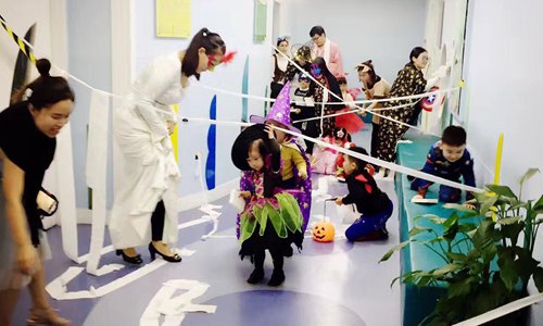 Children dressed up in Halloween costumes play in a kindergarten in Shanghai. Photo: Zhang Yu/GT