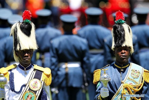 Two members of honor guard are seen during Uhuru Kenyatta's inauguration ceremony at Moi International Sports Center in Nairobi, capital of Kenya, April 9, 2013. Kenya's President Uhuru Kenyatta officially took office on Tuesday after being sworn into office as the East African nation's fourth president. (Xinhua/Meng Chenguang)