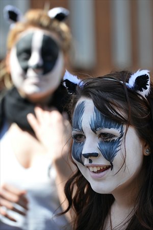 Protesters against a government proposal for the culling of badgers gather outside the Department for Environment, Food and Rural Affairs in central London on Wednesday. Britain is set to cull up to 5,000 badgers in a bid to combat tuberculosis in cattle, which has outraged animal welfare groups, after two pilot schemes were given the green light in February. Photo: AFP