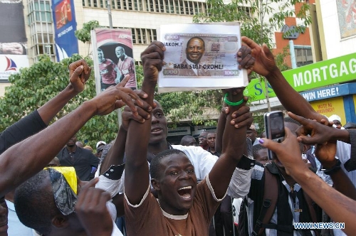 Supporters of Kenya's Prime Minister Raila Odinga, the defeated presidential candidate of the Coalition for Reforms and Democracy (CORD), react during the Supreme Court ruling outside the Supreme Court in Nairobi, capital of Kenya, March 30, 2013. Kenya's Supreme Court on Saturday upheld Uhuru Kenyatta as the duly elected fourth president of Kenya after reaching unanimous decision. (Xinhua/Charles Charles Onyango) 