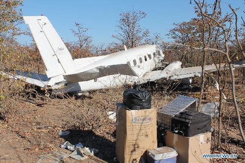 Photo taken on July 2, 2013 shows the wreckage of a South African registered cargo aircraft that crashed on Saturday 7km northwest of the Francistown International Airport in the northeastern part of Botswana just before it landed. Botswana's Aircraft Accident Investigating Unit within the country's Ministry of Transport and Communications on Tuesday announced that investigations into last Saturday's plane crash in the northeastern part of Botswana are ongoing. (Xinhua) 