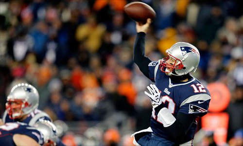 Tom Brady of the New England Patriots passes against the Denver Broncos at the Gillette Stadium in Foxboro, Massachusetts on Sunday. Photo: AFP