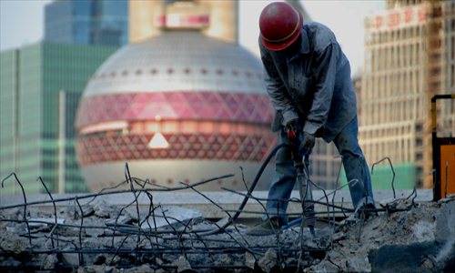 Construction workers sweat under the scorching sun in Pudong New Area. Photo: CFP