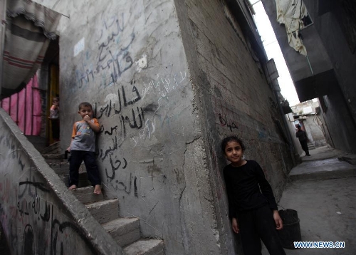  Palestinian kids play in the al-Shati refugee camp in Gaza City on March 13, 2013. About 700,000 Palestinians left their homes and settled in refugee camps in the Gaza Strip, the West Bank and neighboring Arab countries. (Xinhua/Yasser Qudih) 