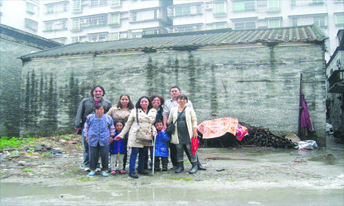 American Lesley Delapaz (center) in front of her grandfather's home with surviving members of his family. Photo: Courtesy of Lesley Delapez