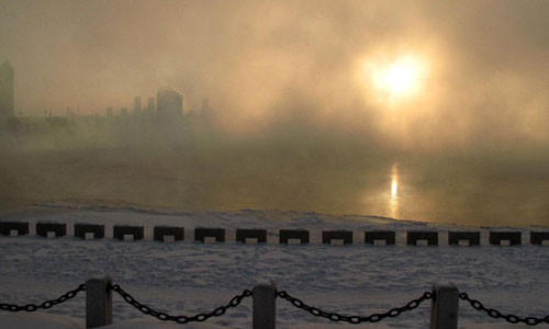 Photo taken on January 4, 2013 shows the morning fog scenery alongside the Songhua River in the city of Jilin, northeast China's Jilin Province. Photo: Xinhua