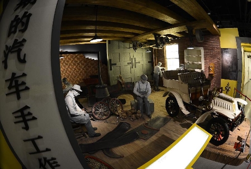 Photo taken on April 28, 2013 shows a workshop model of early automobile manufacturing in the Beijing Auto Museum in Beijing, capital of China. Beijing Auto Museum, a museum aimed at the promotion of auto culture, was awarded the National 4A tourist attraction on Sunday. (Xinhua/Qi Heng)  