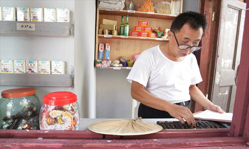 Yanzhidian (literally tobacco and paper shops) selling toothpaste, soap, tissues, light bulbs, candy and snacks. Photo: CFP