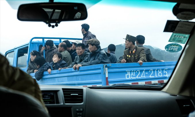 Local people ride on a truck in Rason on June 22, 2012. Photo: CFP