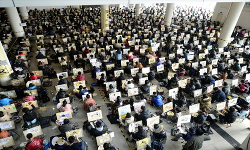 Students sit an entrance exam for the Shandong University of Art & Design in Jinan, East China's Shandong Province on Wednesday. Around 20,000 students took the exam this year, making the competition to enter fiercer than previous two years. Photo: CFP