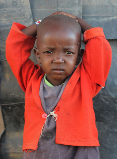 A young Kitengela boy poses for a photo at the camera near his home in the Maasai village outside of Nairobi on February 10, 2013. Photo: Li Jian/GT