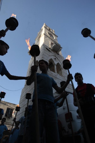 Palestinian boys holding torches take part in a rally in the West Bank city of Nablus on May 14, 2013, to mark Nakba Day on May 15, the annual day of commemoration of the displacement of Palestinians after the establishment of the state of Israel in 1948. (Xinhua/Nidal Eshtayeh) 