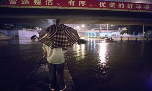 Most people got caught outdoors in the rain at some point on Saturday, with some completely submerged. Is the content of the water a cause for concern? Photos: Li Hao/GT