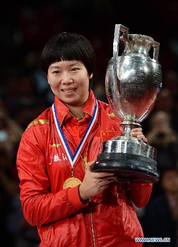  Li Xiaoxia of China poses with the trophy during the awarding ceremony for women's singles at the 2013 World Table Tennis Championships in Paris, France on May 19, 2013. Li claimed the title by defeating her teammate Liu Shiwen with 4-2. (Xinhua/Tao Xiyi) 