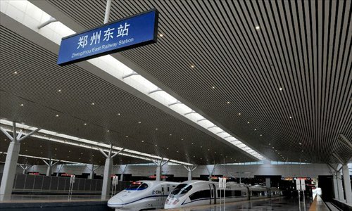 High-speed trains are seen at the Zhengzhou East Railway Station in Zhengzhou, capital of central China's Henan Province, December 18, 2012. The Beijing-Zhengzhou high-speed railway will start service on December 26, connecting the functioning Zhengzhou-Wuhan and Wuhan-Guangzhou high-speed railway to become the world's longest high-speed railway. The new station is the biggest high-speed railway marshalling station of central China as well as a comprehensive passenger tranportation hub incorporating high-speed railway, road transportation, intercity railway, subway and bus. Photo: Xinhua