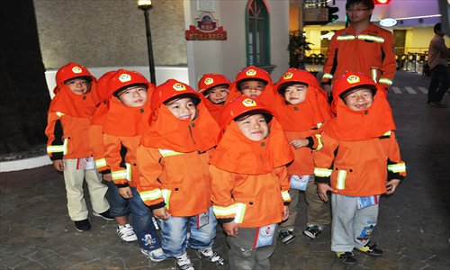 Kids play firefighters at Kubeiland. Photo: Courtesy of the venue