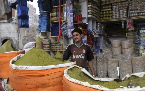 A vendor waits for customers on a street in the Old City of Sanaa, Yemen, on March 24, 2013. According to local media, Yemen's tourism sector suffered losses estimated at one billion U.S. dollars following the 2011 crisis. Vendors in the Old City of Sanaa, a UNESCO World Heritage Site, said the number of foreign tourists declined by at least 90 percent due to the 2011 unrest that severely undermines security in Yemen. (Xinhua/Mohammed Mohammed) 