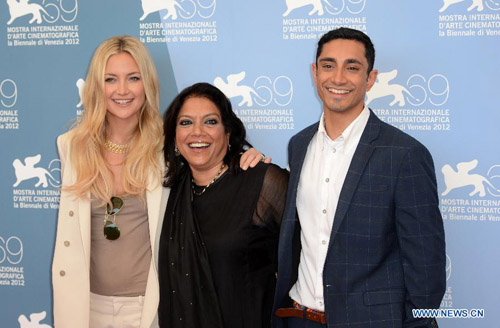 Indian director Mira Nair(C) and cast members pose for photos at the photocall of the opening film 