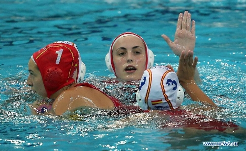 Players of Spain celebrate after the final for the 5th and 6th rank against Italy at the 2013 FINA Women's Water Polo World League Super Final in Beijing, capital of China, June 6, 2013. Spain won 10-8 to rank the 5th of the event. (Xinhua/Li Ming) 