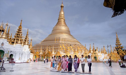 The Shwedagon Pagoda's golden exterior shines in the sun. Photo: CFP