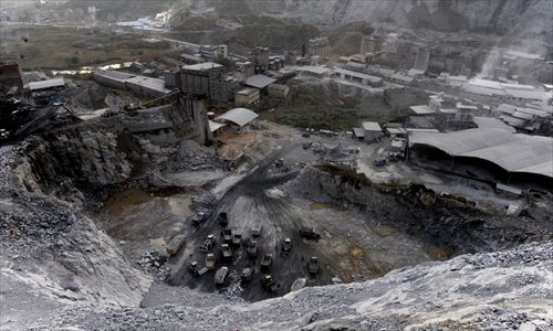 A cloud of dust looks like snowfall over a mine in Zhejiang Province. Photo: CFP