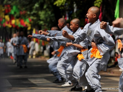 Monks from the Shaolin Temple perform at a carnival during the China Kunming Culture and Tourism Festival in Kunming, capital of southwest China's Yunnan Province, April 29, 2013. (Xinhua/Lin Yiguang)  