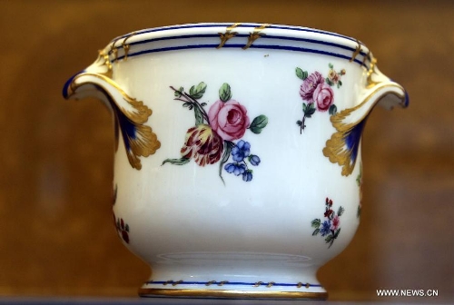 Photo taken on May 4, 2013 shows a 18th-century-made porcelain bucket for cooling wine glasses displayed in an exhibition of 