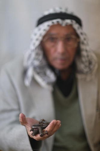 Abu Hafez, a 68-year-old Palestinian, holds the keys of the former house displaced since 1948, in Al-Jalazoun Refugee camp near Ramallah in the West Bank on May 14, 2013. Palestinians are preparing for Nakba Day on May 15, marking thousands of Palestinians that were forced to leave their homes during the Arab-Israeli war in 1948. (Xinhua/Fadi Arouri) 