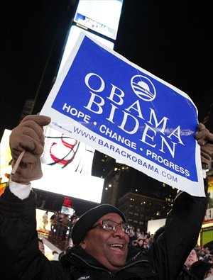 A supporter of U.S. President Barack Obama reacts as he confirms the re-election of President Barack Obama in New York, November 6, 2012. Photo: Xinhua