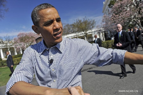 U.S. President Barack Obama shakes hands with participants during in the annual White House Easter Egg Roll on the South Lawn of the White House in Washington D.C., capital of the United States, April 1, 2013. U.S. President Barack Obama hosted the annual celebration of Easter on Monday, featuring Easter egg roll, live music, sports, cooking and storytelling. (Xinhua/Zhang Jun) 