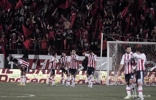 Chivas' players react after the third score of Tijuana's Xolos during a Liga MX soccer match held in Tijuana, Mexico, on May 3, 2013. (Xinhua/Guillermo Arias) 