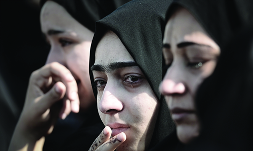 Bahraini women mourn during the funeral of Hussain Mahdi Habib in the village of Sitra, south of Manama, on Sunday. Habib, 20, a political prisoner, ... - 288e1d17-0a7a-439d-8abf-3b855dfb783c