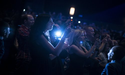 People listen as US President Barack Obama speaks during a campaign event at the Nokia Theater in Los Angeles, California on Sunday. Photo: AFP 