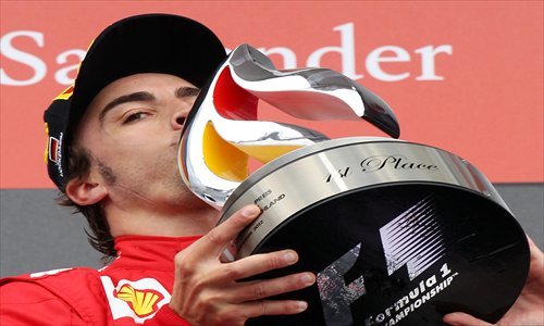 Fernando Alonso celebrates after winning the German Grand Prix on Sunday. Photo: IC