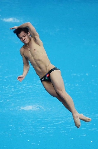  He Chong of China competes during the men's 3m springboard final at the FINA Diving World Series 2013 held at the Aquatics Center, in Beijing, capital of China, on March 16, 2013. He Chong took the 2nd place with 521.50 points. (Xinhua/Tao Xiyi)