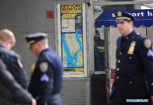  Policemen work near the accident site where a ferry boat crashed into Pier 11 in lower Manhattan, New York, the United States, on Jan. 9, 2013. A high-speed ferry loaded with hundreds of commuters from New Jersey crashed into a dock near Wall Street on Wednesday during the morning rush hour, injuring 57 people. (Xinhua/Shen Hong) 