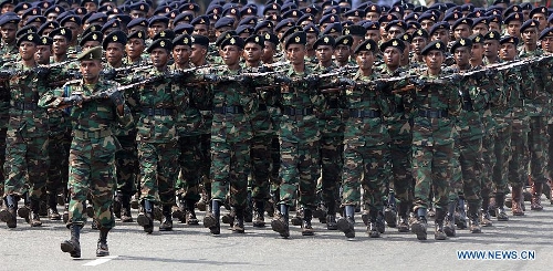 Sri Lankan army personnel march during the Victory Day parade in Colombo, Sri Lanka, May 18, 2013. Sri Lanka on Saturday celebrated the fourth anniversary of the defeat of the Tamil Tiger rebels after 30 years of war. (Xinhua/Pushpika Karunaratne) 