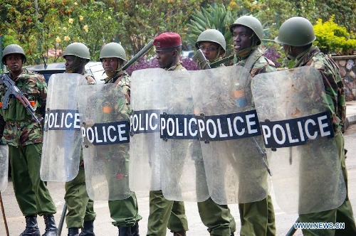 Kenya's Riot police stand guard outside the Supreme Court in Nairobi, capital of Kenya, March 30, 2013. Kenya's Supreme Court on Saturday upheld Uhuru Kenyatta as the duly elected fourth president of Kenya after reaching unanimous decision. (Xinhua/Charles Charles Onyango) 