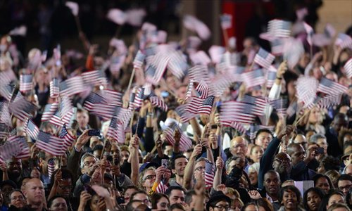 Supporters of U.S. President Barack Obama gather at an Election Night rally in Chicago, Illinois on November 6, 2012. Obama has won re-election in the U.S. presidential race, TV networks projected on Tuesday. Photo: Xinhua