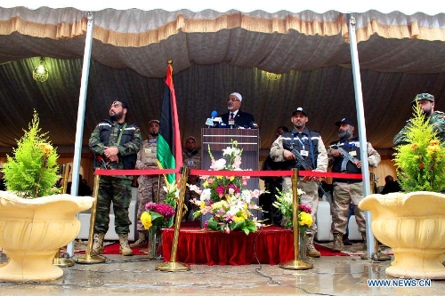 President of the General National Congress of Libya Mohammed Megaryef (C) addresses a celebration for the second anniversary of the uprising that toppled the regime of strongman Muammar Gaddafi in Benghazi, on Feb. 17, 2013. (Xinhua/Mohammed El Shaiky) 