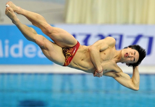 Qin Kai of China competes during the men's 3m springboard final at the FINA Diving World Series 2013 held at the Aquatics Center, in Beijing, capital of China, on March 16, 2013. Qin Kai claimed the champion with 548.65 points. (Xinhua/Gong Lei)