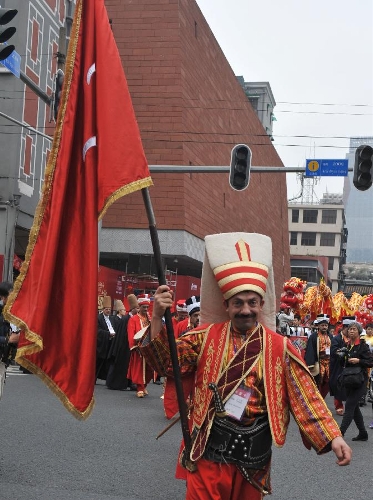 Artists from Turkey take part in a parade of a temple fair in Guangzhou, capital of south China's Guangdong Province, Feb. 24, 2013. The 7-day-long temple fair, as a cultural carnival, will showcase various cultural forms such as folk customs, praying culture and cuisine culture. (Xinhua/Lu Hanxin)