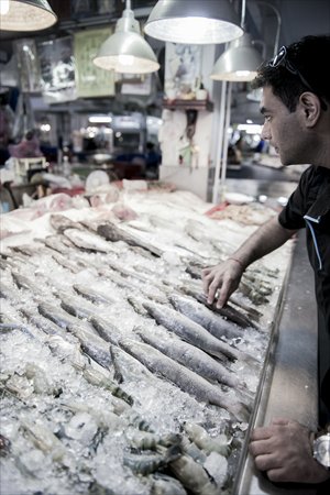 World chef Gaggan Anand picks out a fish for dinner. Photo: Courtesy of Gaggan restaurant 