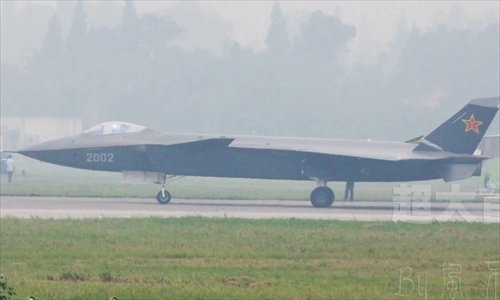 The J-20 stealth fighter, number 2002, completes a test flight at an undisclosed Chinese airport. This is the second J-20 stealth fighter, following the J-20 stealth fighter number 2001. From the photos it is obvious the second J-20 stealth fighter has made a few physical modifications to its structure when compared with the first one. Photo: mil.huanqiu.com