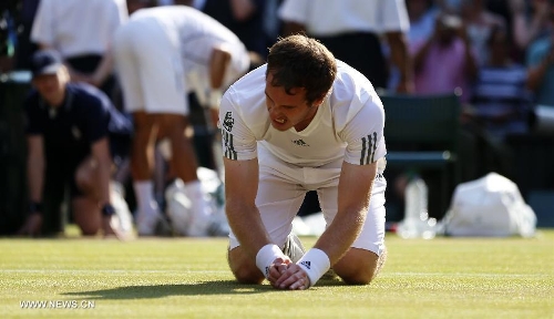 Andy Murray of Great Britain celebrates after winning the men's singles final with Novak Djokovic of Serbia on day 13 of the Wimbledon Lawn Tennis Championships at the All England Lawn Tennis and Croquet Club in London, Britain, on July 7, 2013. Andy Murray on Sunday won his first Wimbledon title and ended Britain's 77-year wait for a men's champion with a 6-4 7-5 6-4 victory over world number one Novak Djokovic. (Xinhua/Wang Lili) 