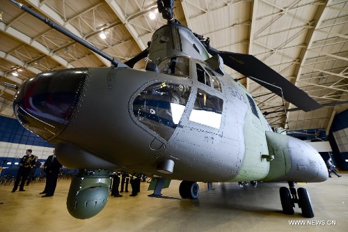 A new CH-147F Chinook helicopter is displayed at the unveiling ceremony in Ottawa June 27, 2013. The 15 newly purchased F-model Chinooks will be engaged in support, domestic and foreign operations for the Royal Canadian Air Force's reactivated 