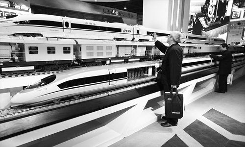 Railway enthusiasts look at a display of Chinese high-speed trains at The Modern Railways 2012, an exhibition hosted by the Ministry of Railways at China International Exhibition Center, Chaoyang district Tuesday. Photo: Li Hao/GT