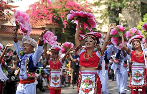 Young people of the Bai ethnic group perform at a carnival during the China Kunming Culture and Tourism Festival in Kunming, capital of southwest China's Yunnan Province, April 29, 2013. (Xinhua/Lin Yiguang)  